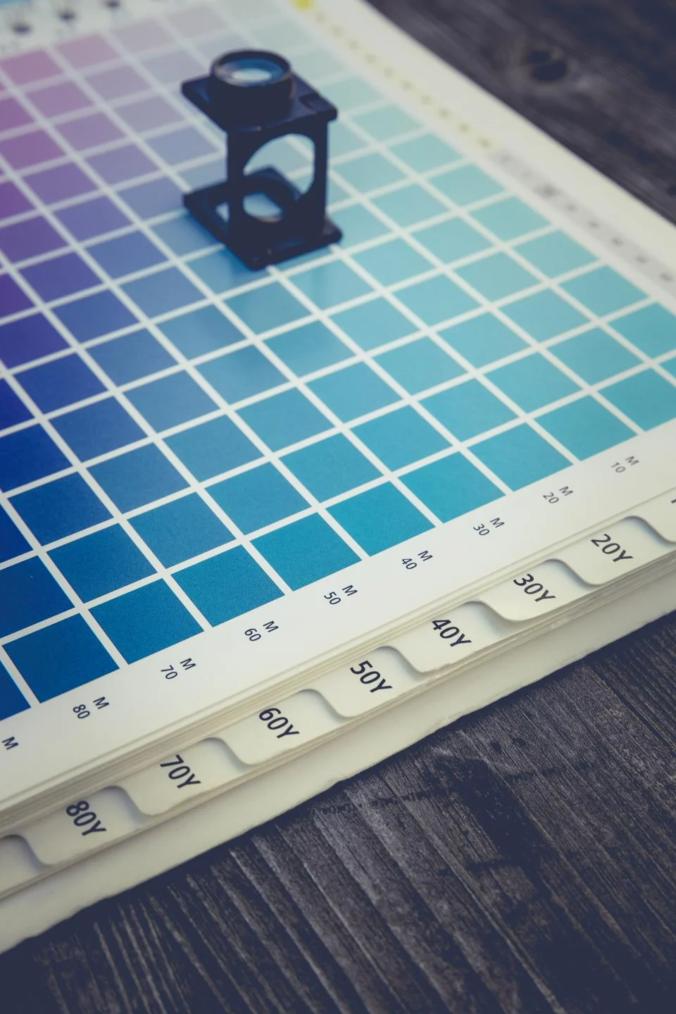 Creative studio desk with design materials and visual references